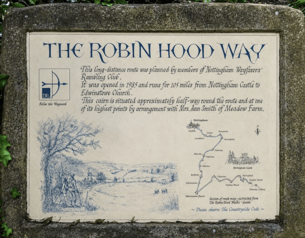 Sign describing The Robin Hood Way, a long-distance route of 105 miles from Nottingham Castle to Edwinstowe Church, launched in 1985. The sign features a map and illustrations of the route.