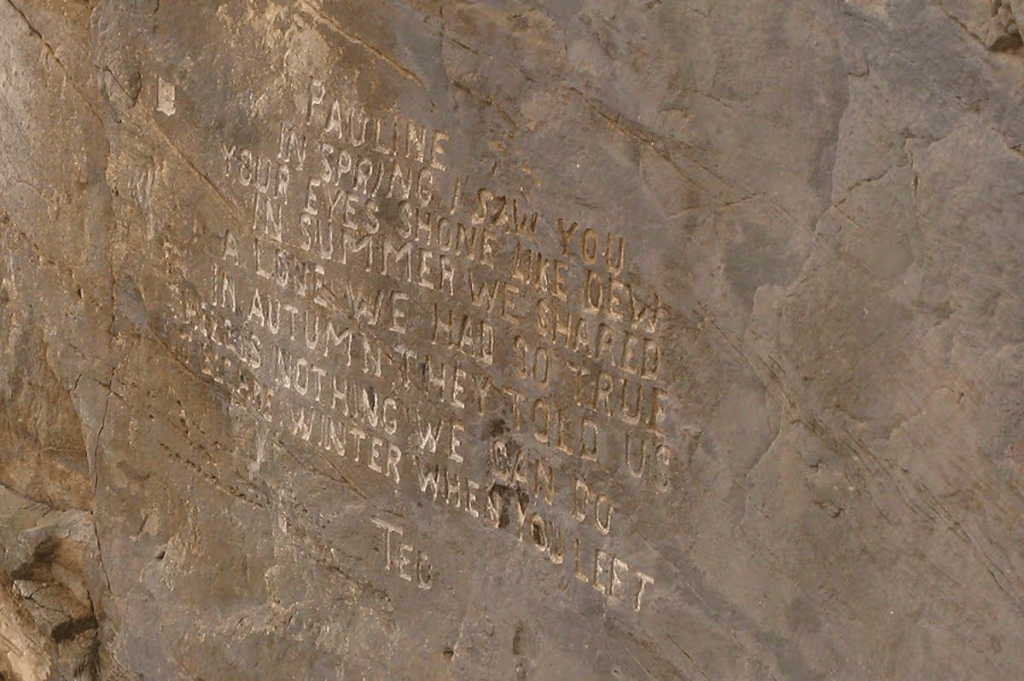 Engraved poem on a rocky surface, featuring the name 'Pauline' and personal reflections on seasons and relationships.